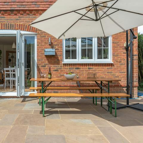 Dine alfresco on sunny days at the table on the patio