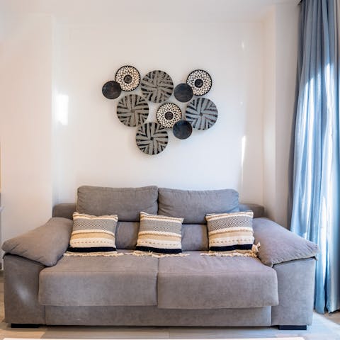 Recline on the plump sofa with your holiday read