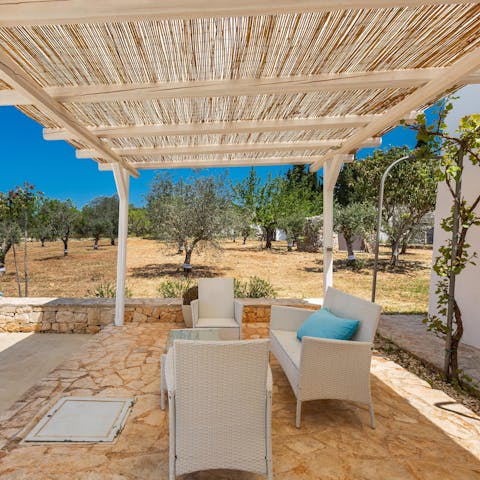 Sip your morning coffee beneath the shade of the pergola