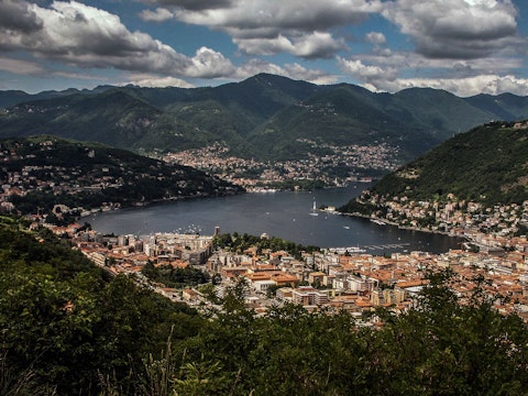 Sail or simply gaze upon Lake Como's glacial waters and mountain backdrop, a thirty-minute walk