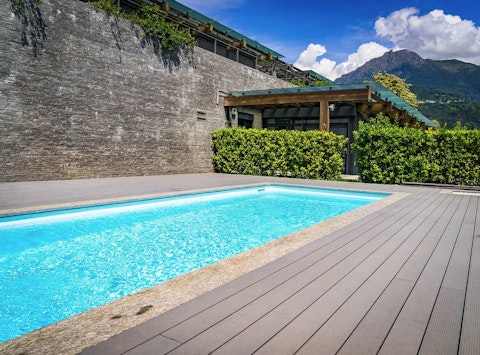 Cool off in the communal pool with Alpine peaks as your backdrop