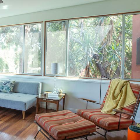 Lounge about and enjoy the lovely greenery outside your windows