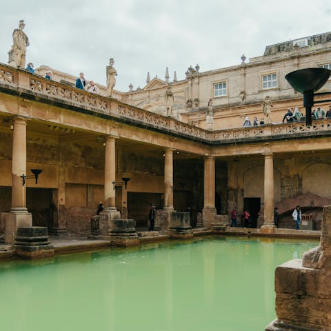 Visit the Roman Baths, just a ten-minute walk away