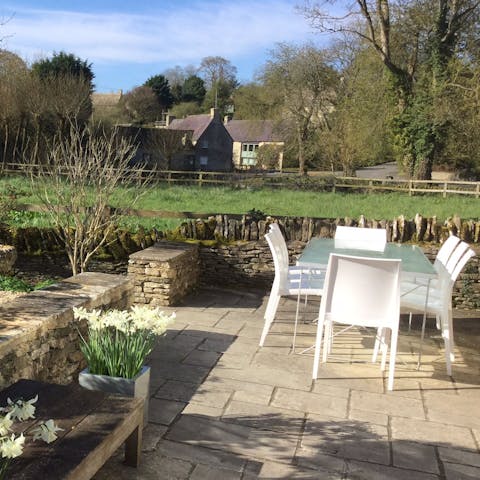 Take in scenic views of the Cotswolds countryside and charming architecture from the garden