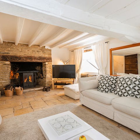 Cosy up in front of the wood-burner fireplace after a country walk to one of the neighbouring villages