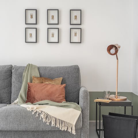 Recline on the comfortable sofa with a refreshing drink