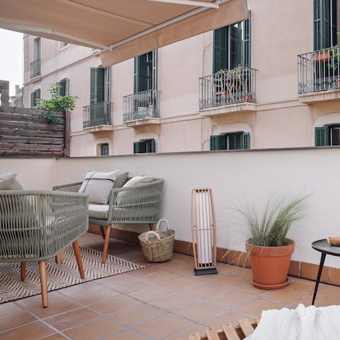Relax under the shade of the canopy on your private terrace