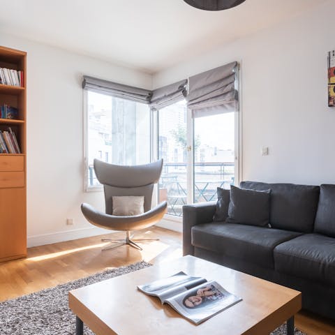 Lounge next to the huge corner window in the modern chair