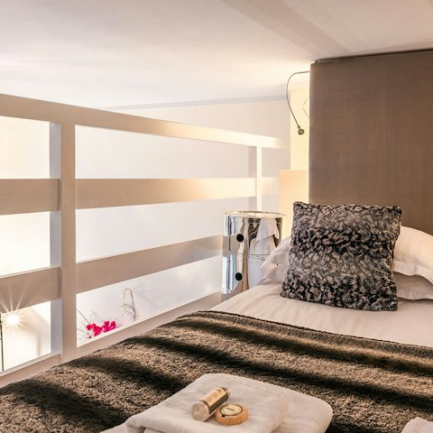 Sleep soundly up in the unique, mezzanine bedroom