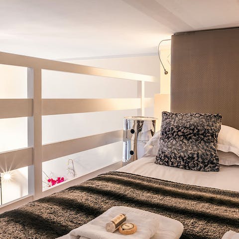 Sleep soundly up in the unique, mezzanine bedroom