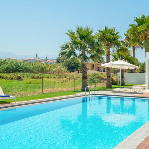 Cool down in the private pool after catching some rays on the loungers