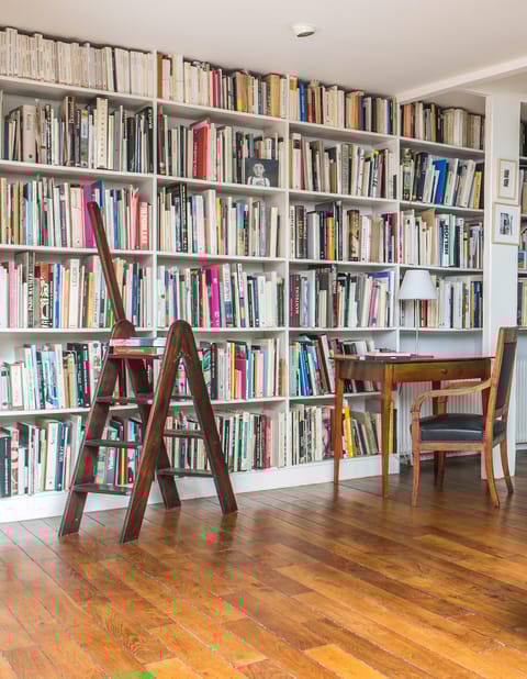 Choose an art book from the wall to wall bookcase