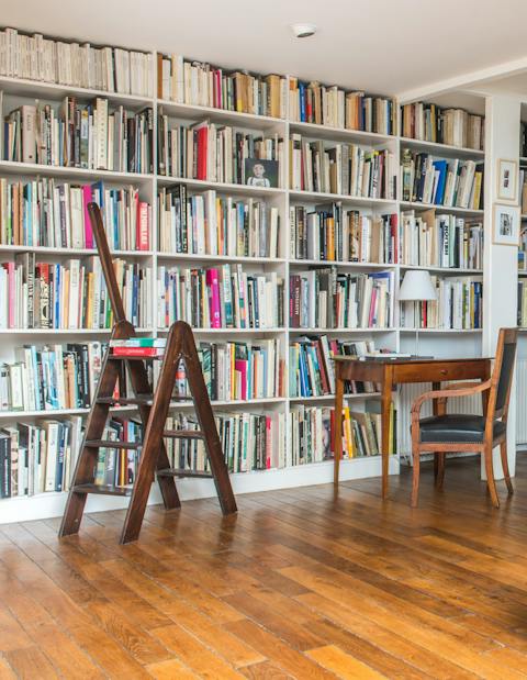 Choose an art book from the wall to wall bookcase