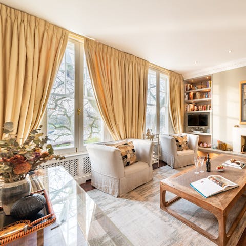 Watch the river from your sash-windowed living room