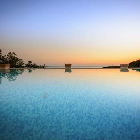 Slip into the heated swimming pool with massage jets as the sun starts to set