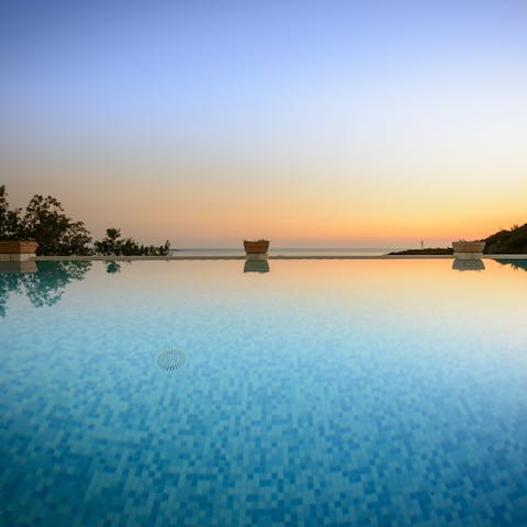 Slip into the heated swimming pool with massage jets as the sun starts to set