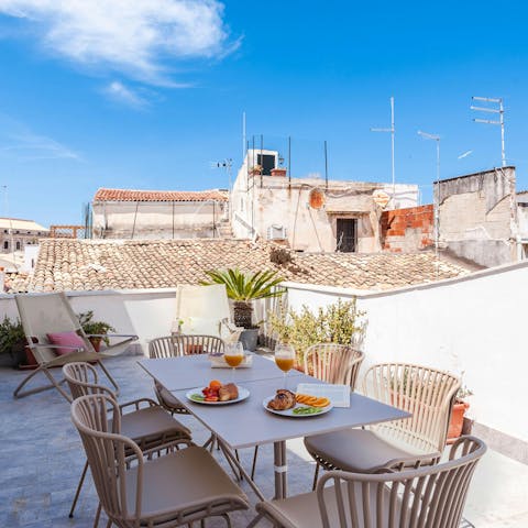 Enjoy breakfast on the rooftop terrace