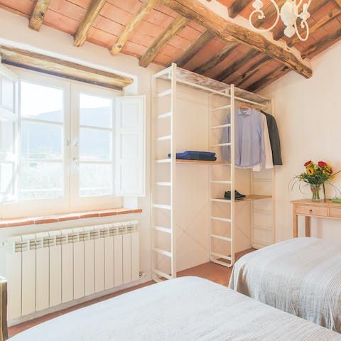 Admire the striking, original architecture of the home, such as wooden beamed ceilings
