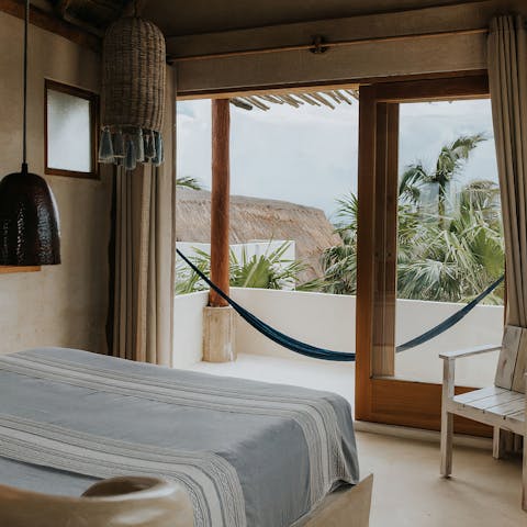 Admire the view from your shaded balcony as you relax in the hammock