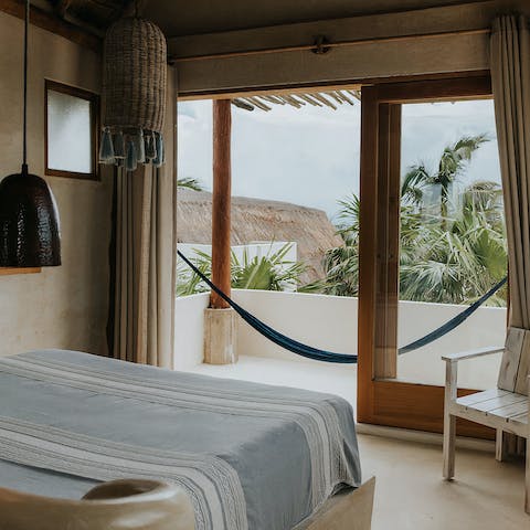 Admire the view from your shaded balcony as you relax in the hammock