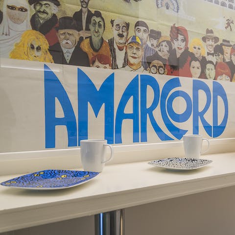 Start your morning with a delicious breakfast and an espresso in front of the vintage Fellini poster