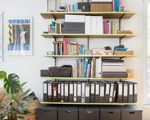 The host's collection of books and guides