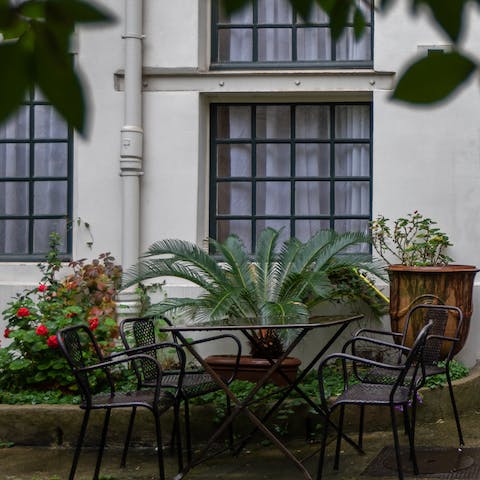 Enjoy a glass of wine in the courtyard