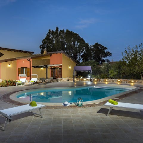 Indulge in an evening swim in the kidney-shaped pool