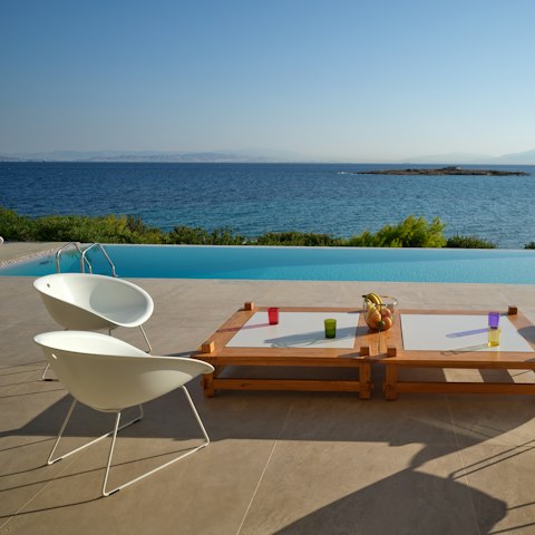 Stretch out by the infinity pool and soak up the sunshine