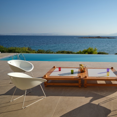 Stretch out by the infinity pool and soak up the sunshine