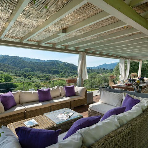 Admire sweeping views of the hills of Camaiore from the terrace
