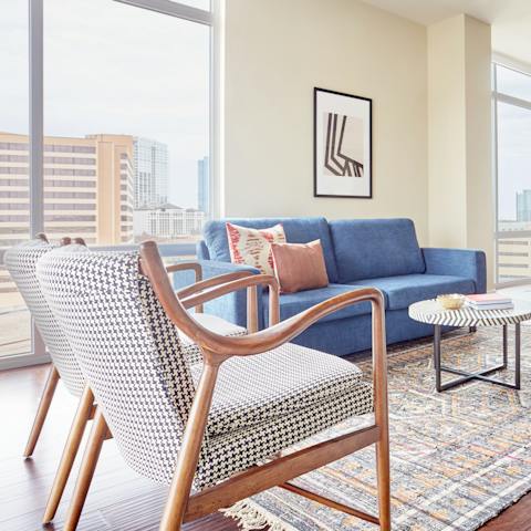 Relax in your home's stylish living room with views