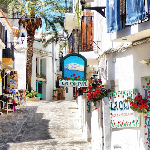Wind your way through the old streets of Ibiza Town, a ten-minute drive away
