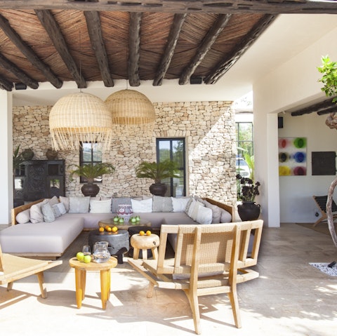 Lounge under the shade of the covered terrace with a cool drink in hand