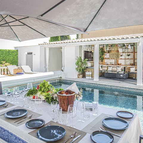 Dine al fresco in the shade of the parasol, enjoying the fresh air