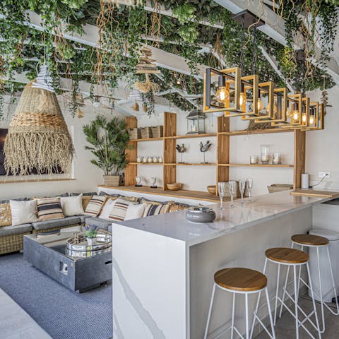 Pour yourself a glass of wine and enjoy sunny days from the shady pool house