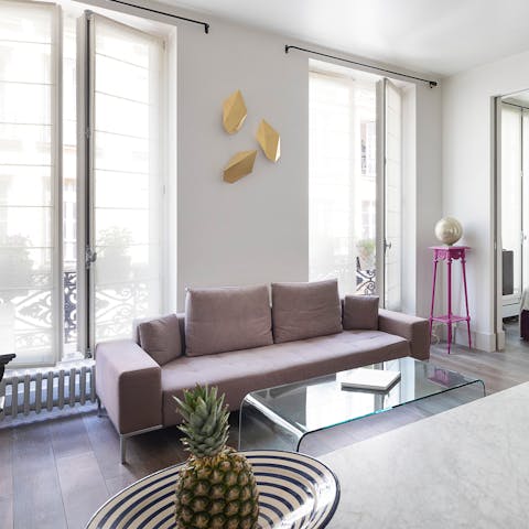 Stretch out in the light and airy living room after an action-packed day of exploring Paris