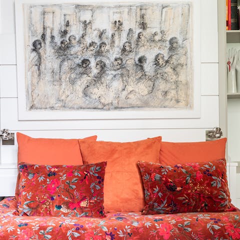 Rest weary limbs in the vibrant, art-filled living space