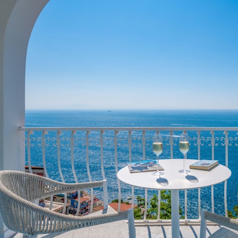 Sip something bubbly on the balcony while gazing out to sea