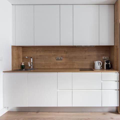 Fire up the coffee pod machine in the minimalist kitchen