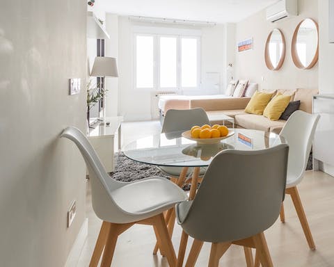 Enjoy a breakfast of coffee and pastries at the bright dining table