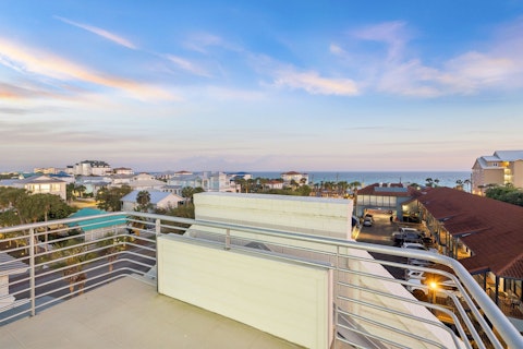 Watch the Gulf horizon glow from your elevated rooftop terrace