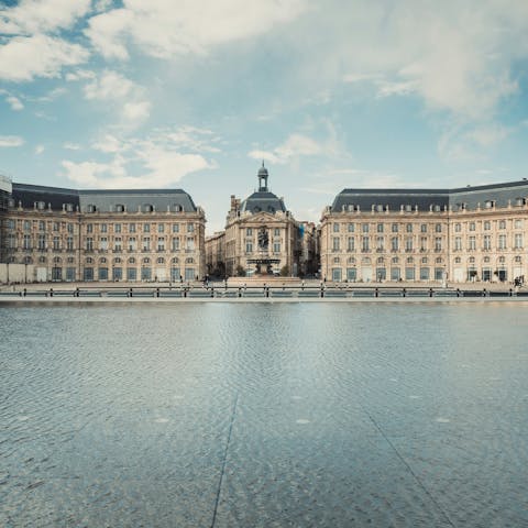 Visit the Place de la Bourse in Bordeaux, a forty-five minute drive away