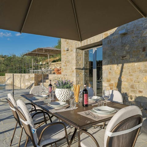 Open a bottle of Chianti wine to share on the terrace