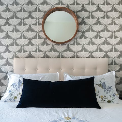 The winged wallpaper in the bedroom