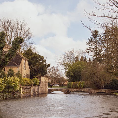 Pay a visit to Bourton-on-the-Water, 15 miles away