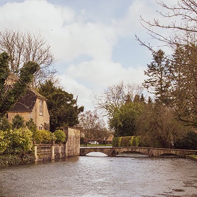 Pay a visit to Bourton-on-the-Water, 15 miles away