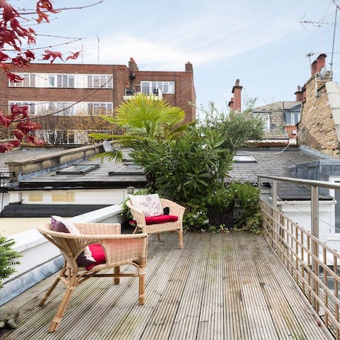 Sip sundowners on the charming roof deck