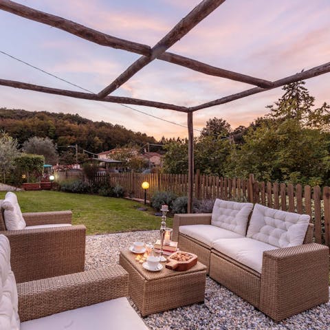 Sip on a Campari spritz in the outdoor seating area as the sunsets