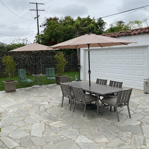Make up a pitcher of cocktails and sip together around the alfresco dining set